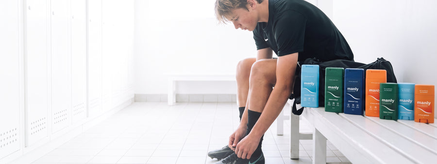 Teenage boy in a locker room after sport, when body wash for teenage boys in puberty matters most