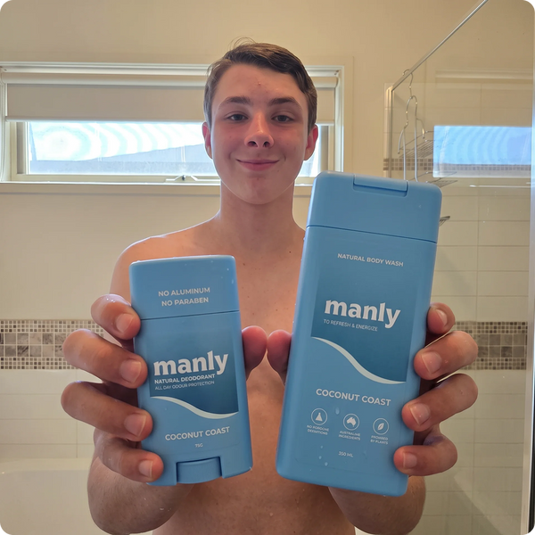 Teenager holding the Coconut Coast teen body wash and deodorant