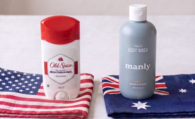 Old Spice deodorant on a US flag beside Manly body wash on an Australian flag